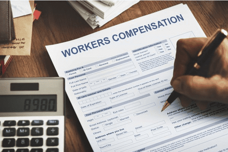 Person filling out a workers comp claim